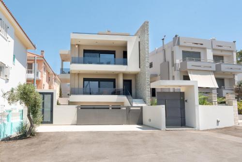 a house with a driveway in front of it at Ixia Breeze 3 in Ixia