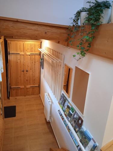 a staircase in a house with wooden walls at Srub Javorná - apartmány Šumava in Javorná