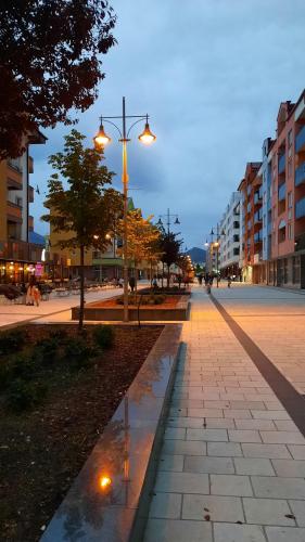 a city street with a street light and buildings at Apartmani RALE rooms in Sarajevo