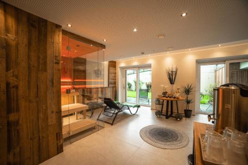 a kitchen with a desk and a table in a room at Boutiquehotel - Michl in Sautens