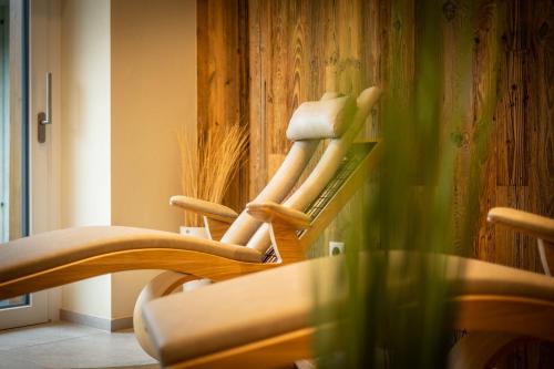 a group of chairs sitting in a room at Boutiquehotel - Michl in Sautens