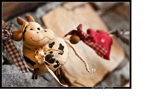 a toy giraffe wearing apron and apron at Baita La Jolie Bergere in La Salle