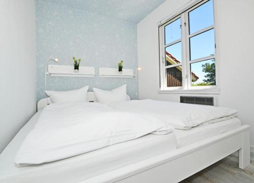 En eller flere senge i et værelse på Ferienanlage Bansin Seepferdchen 4