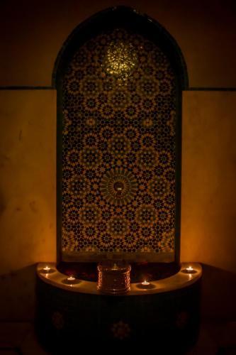 a large glass shower with lights in a room at Hotel Atlantic Agdal in Rabat