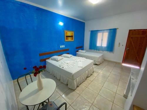 Ένα ή περισσότερα κρεβάτια σε δωμάτιο στο Hotel Pousada Arauna