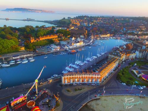 an aerial view of a harbor with boats in the water at The Roundhouse in Weymouth