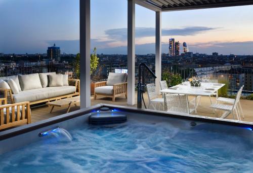 a hot tub on the roof of a building at Milano Verticale | UNA Esperienze in Milan
