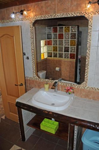 a bathroom with a sink and a mirror at Casa Guanche in Cruce de Arinaga