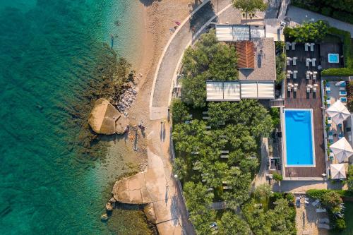 an aerial view of a beach and the ocean at Hotel Vila Rova in Malinska