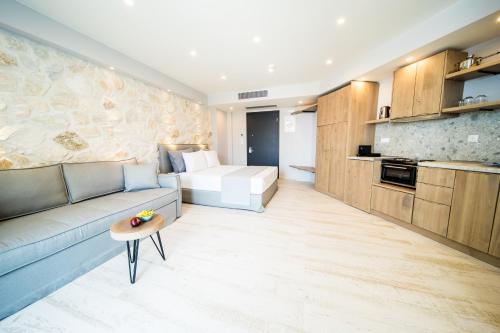 a living room with a couch and a table at Kali Thea Suites in Neos Marmaras