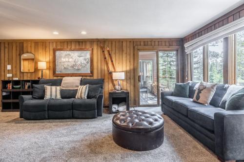 a living room with a couch and a table at Mountainback 15 in Old Mammoth