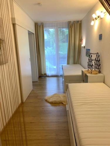 Ένα ή περισσότερα κρεβάτια σε δωμάτιο στο Ferienwohnung Oberstdorf