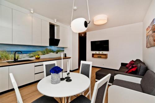 Kuchyň nebo kuchyňský kout v ubytování BlueApart Apartamenty Hotelowe Nexo