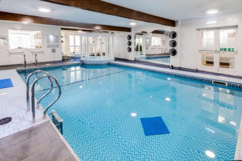 a large swimming pool in a hotel with a large pool at Park Manor Hotel in Scarborough