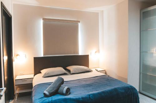 Cama ou camas em um quarto em Gray Door Apartments - Adults only