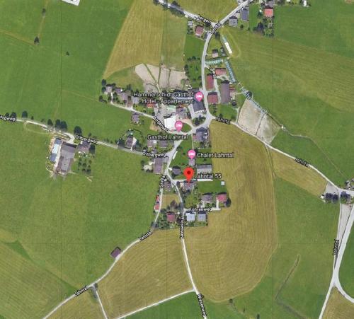 a map of a park with a red circle at Chalet Mandl Sauna Pool Rollstuhlgängig in Maishofen