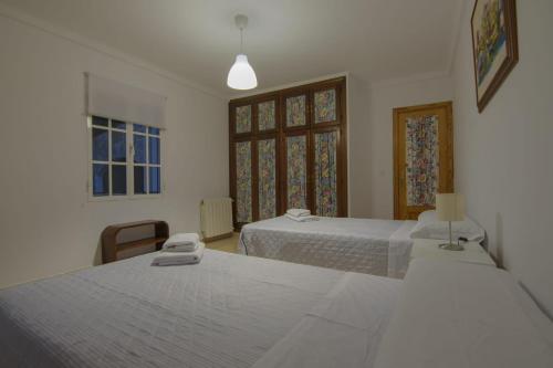 Postel nebo postele na pokoji v ubytování La Comuna Ronda