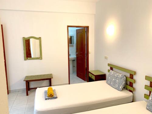 Ένα ή περισσότερα κρεβάτια σε δωμάτιο στο The Central Guesthouse
