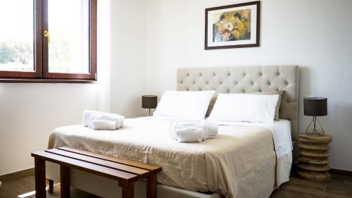 Tempat tidur dalam kamar di Casale Adriatico B&B