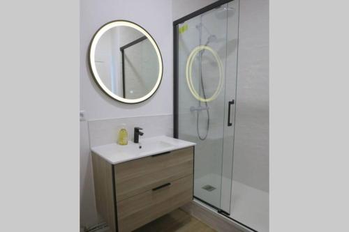 a bathroom with a sink and a mirror at Dinan Château in Dinan