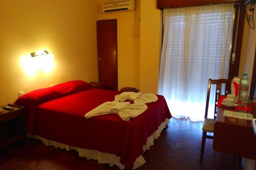 Ένα ή περισσότερα κρεβάτια σε δωμάτιο στο Crystal Hotel