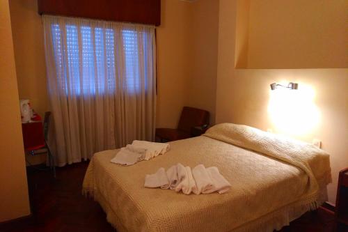 Ένα ή περισσότερα κρεβάτια σε δωμάτιο στο Crystal Hotel