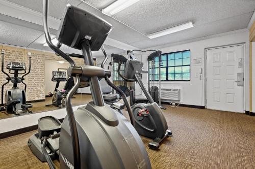 a gym with treadmills and elliptical machines at La Quinta Inn by Wyndham Costa Mesa Orange County in Costa Mesa