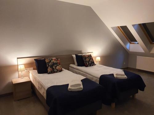 Ένα ή περισσότερα κρεβάτια σε δωμάτιο στο Hotel Garbów *** Centrum Konferencyjno - Bankietowe