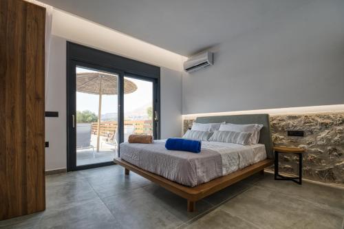 Ένα ή περισσότερα κρεβάτια σε δωμάτιο στο Terra Secreta Luxury Villas
