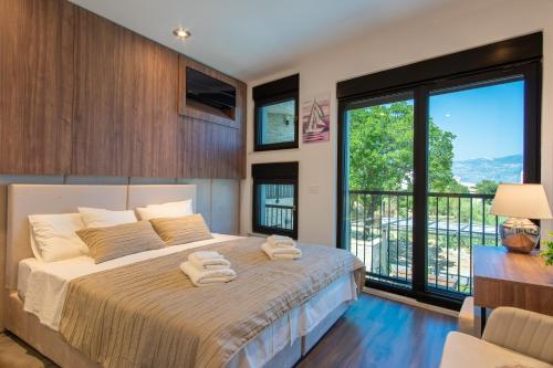 Ένα ή περισσότερα κρεβάτια σε δωμάτιο στο Villa Perla Nera & Villa Nevera