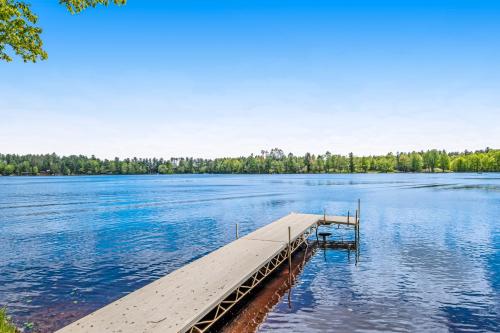 a dock in the middle of a large lake at Road Lake Escape in Tomahawk