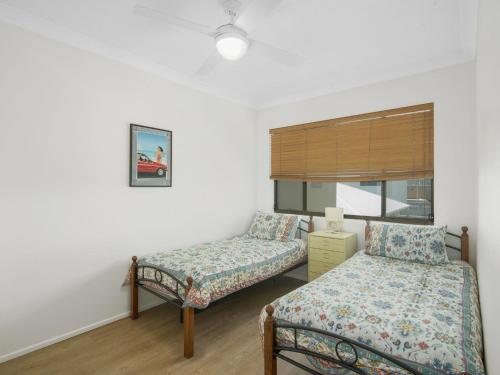Postel nebo postele na pokoji v ubytování Bilinga Gardens Unit 7