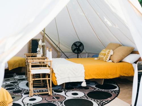 a bedroom with two beds in a marquee at The Hideaway Cabarita Beach in Cabarita Beach