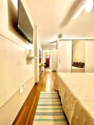 Ένα ή περισσότερα κρεβάτια σε δωμάτιο στο Apartamento temporada Guarapari-Centro