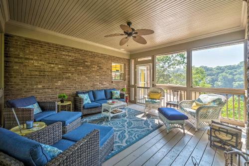 a screened in porch with a couch and chairs at Luxe Lake Cumberland Retreat with Decks on 1 Acre! in Jamestown