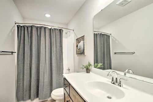 a bathroom with a sink and a toilet at Upscale Townhome in Causeways on Gull Resort! in Nisswa