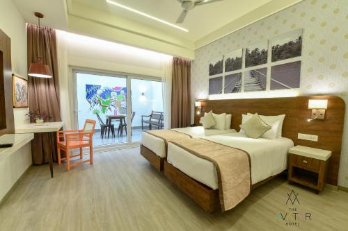 Cama ou camas em um quarto em The Avatar Hotel & Convention