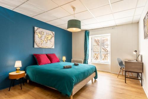 מיטה או מיטות בחדר ב-Le 22-GregIMMO-Appart'Hôtel