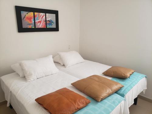 Ένα ή περισσότερα κρεβάτια σε δωμάτιο στο Aima Ibagué