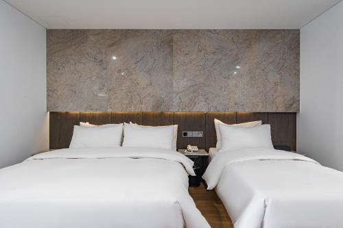Ένα ή περισσότερα κρεβάτια σε δωμάτιο στο Amare Hotel Jongno