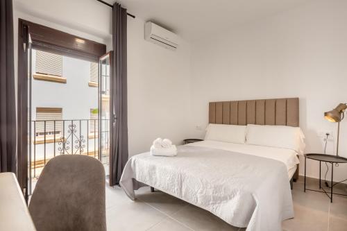 Postel nebo postele na pokoji v ubytování Villamarta Boutique Rooms