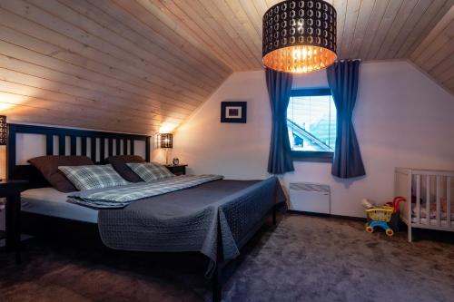 Postel nebo postele na pokoji v ubytování Villa Jasen