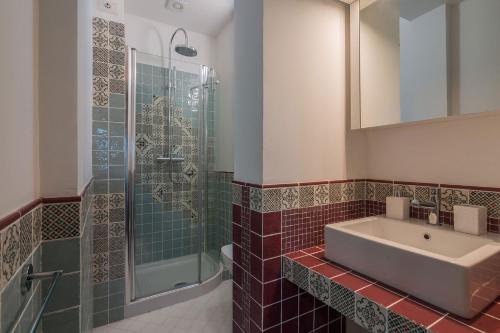 a bathroom with a sink and a shower at Villa Flavia in Filottrano