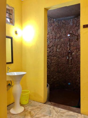 a bathroom with a sink and a shower at Magharibi House in Nungwi