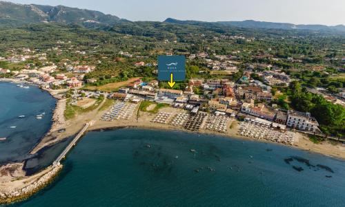 an aerial view of a resort next to the beach at Aqua Luxury Suites by Estia in Roda