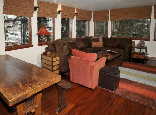 a living room with a couch and a table at Lionshead Center #201 Condo in Vail