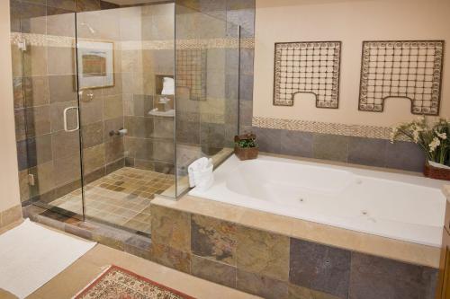 a large bathroom with a tub and a shower at Settlers Lodge #302 Condo in Edwards