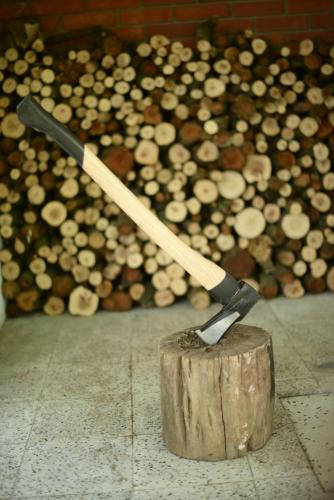 a knife sitting on top of a piece of wood at Villa Dijana - Pool, Spa, Outdoor Kitchen in Belgrade