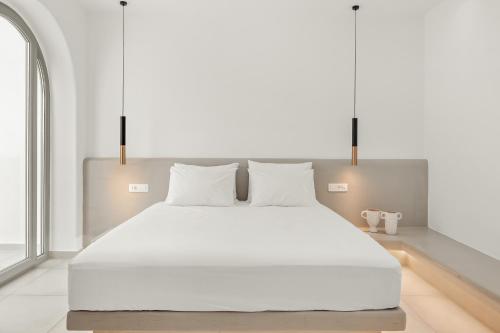 Ένα ή περισσότερα κρεβάτια σε δωμάτιο στο Oyster Luxury Suites
