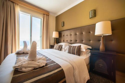 Ein Bett oder Betten in einem Zimmer der Unterkunft Appart-hotel La Source